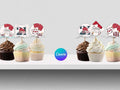 Decorative cupcake toppers with personalized designs on a white surface, featuring the Canva logo.