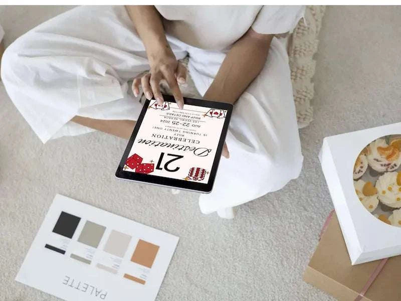 Vegas 21st Editable Birthday Invitation LuaSol Shoppe tablet being held by person sitting on carpeted floor. 